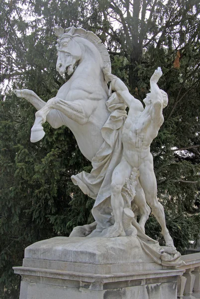 VIENNA, AUSTRIA - APRIL 25, 2013: Statue of a man with a horse near Museum of Natural History and the Art History Museum in Vienna, Austria