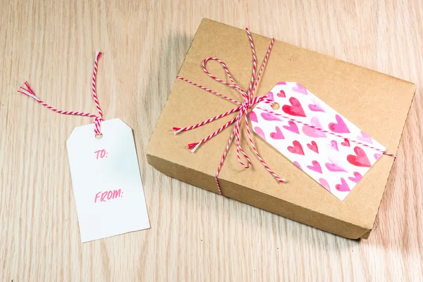 Handmade card on the wooden background