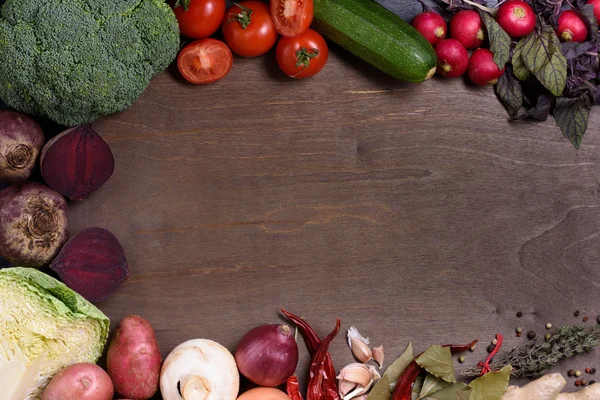 Vegetables on wooden board, top view, copy space. Organic healthy market food.