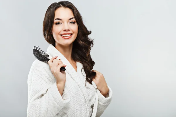 Girl holding a hair brush