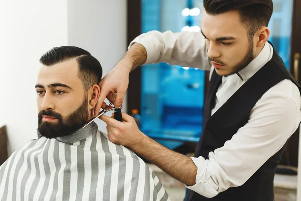 Barber making a beard