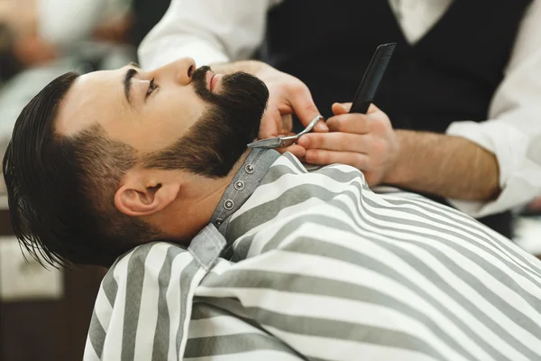 Barber making a beard