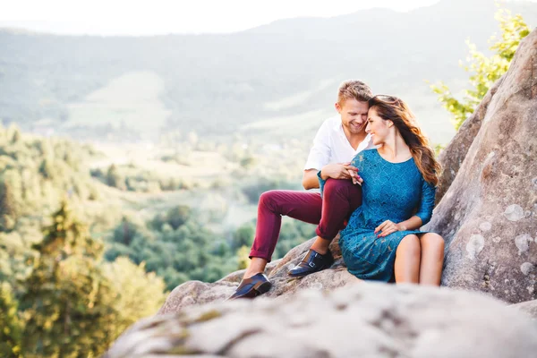 Nice couple on top of rock