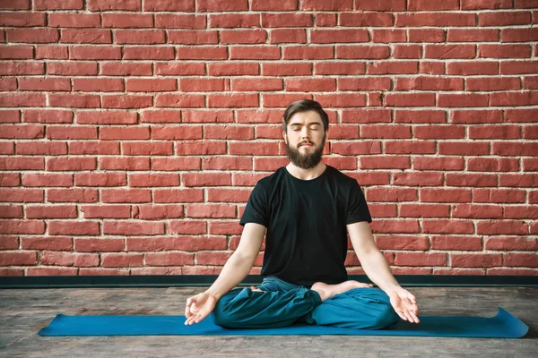 Yoga positions at wall background