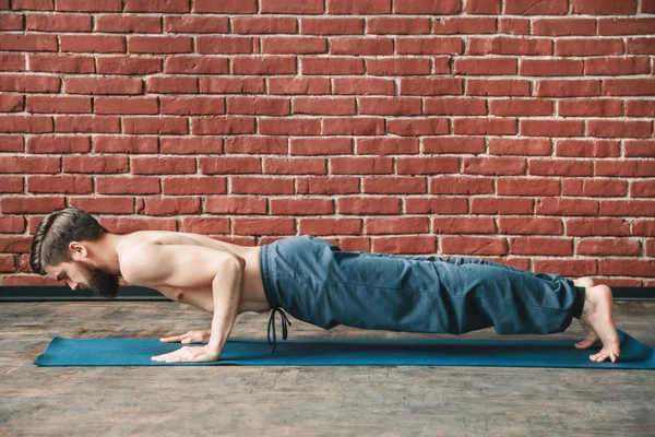 Yoga positions at wall background