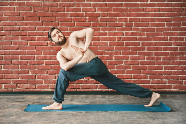 Yoga positions at wall background