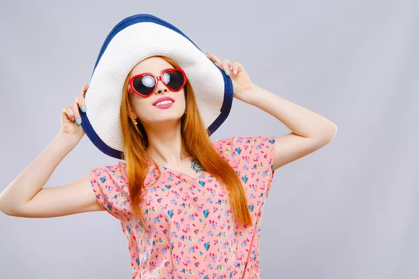 Smiling girl with hat and sunglasses