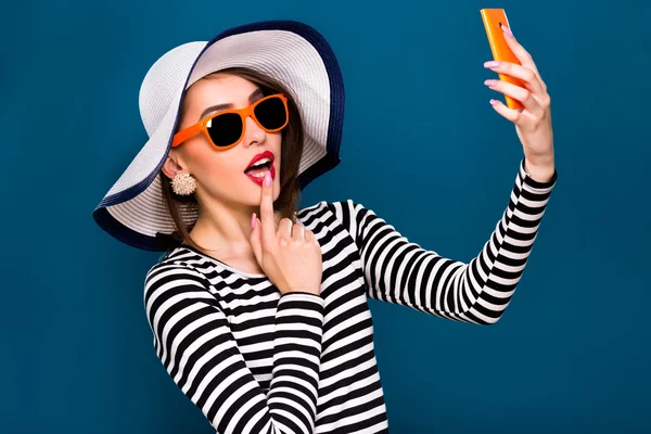 Woman is taking selfie on smart phone