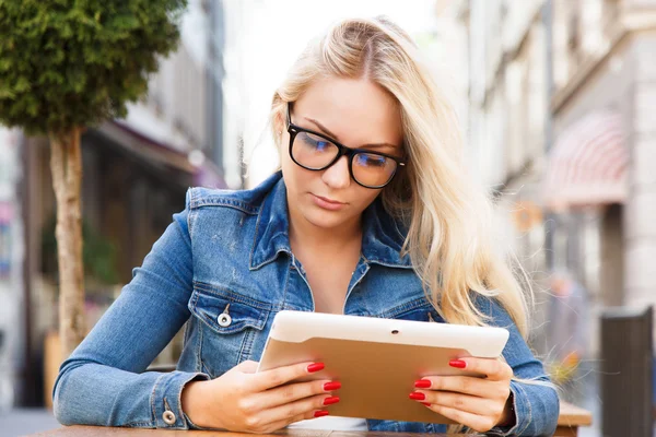 Charming girl with digital tablet