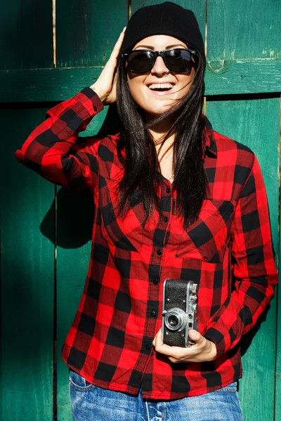 Girl posing with retro camera