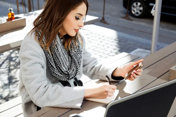 Young woman looking at smart phone