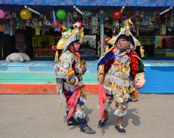 : Guatemalan fiesta Masked dancers