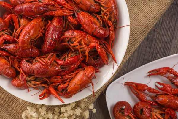 Boiled big crawfish on the wooden surface