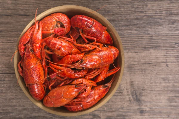 Boiled big crawfish on the wooden surface