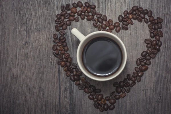Cup of coffee inside the beans heart