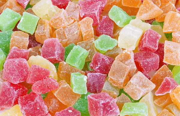 Multi-coloured sweet fruit candy close-up as a background. Succade.