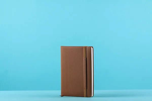 Planner notebook in blue pastel background