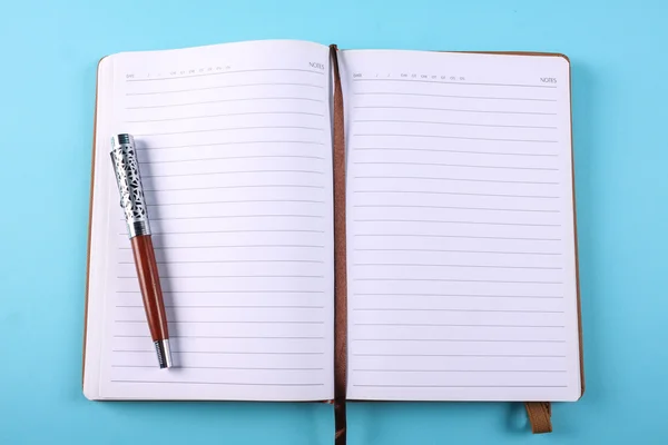Planner notebook in blue pastel background