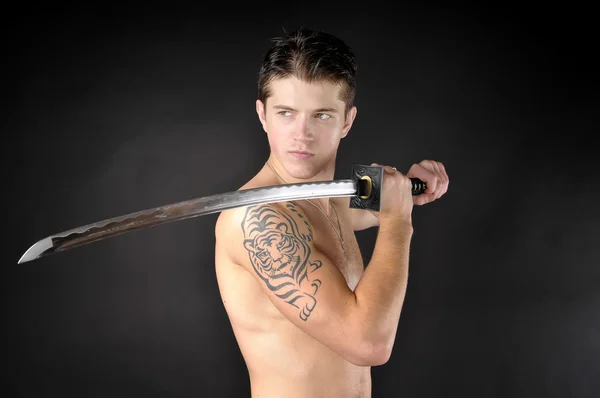 Athletic man with sword