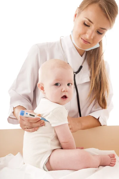 Nurse measures the temperature of a baby, isolated on white back