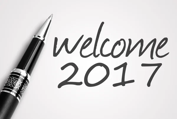 Pen writes 2017 welcome on paper