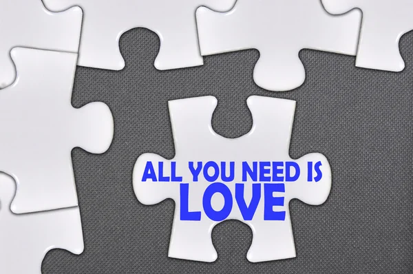 Jigsaw puzzle written word all you need is love