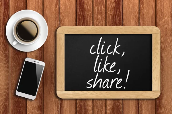 Coffee, phone  and chalkboard with  word click, like, share!