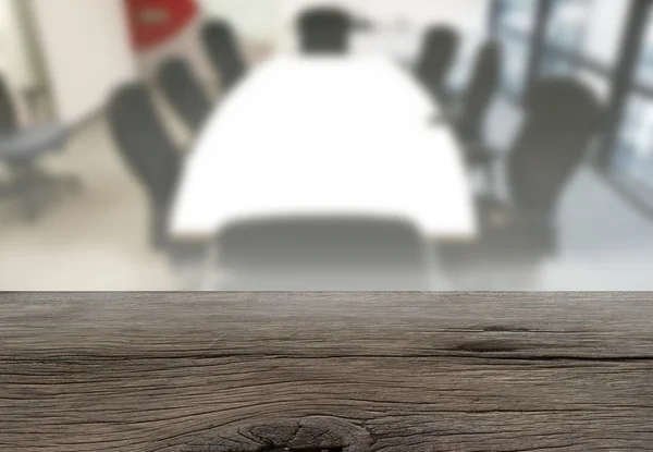 Old table top texture on blur meeting room background