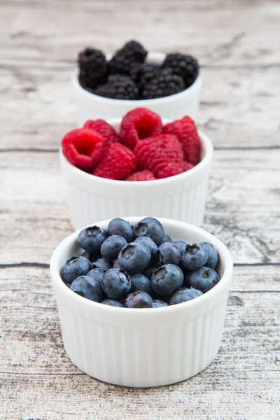 Wild berries, Raspberries, blueberries and blackberries in bowls