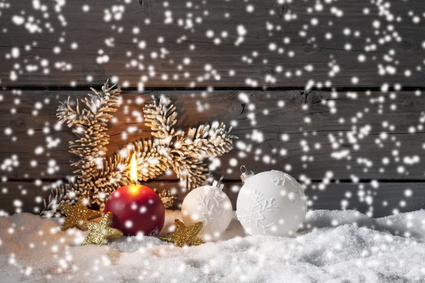 Christmas decorations on pile of snow