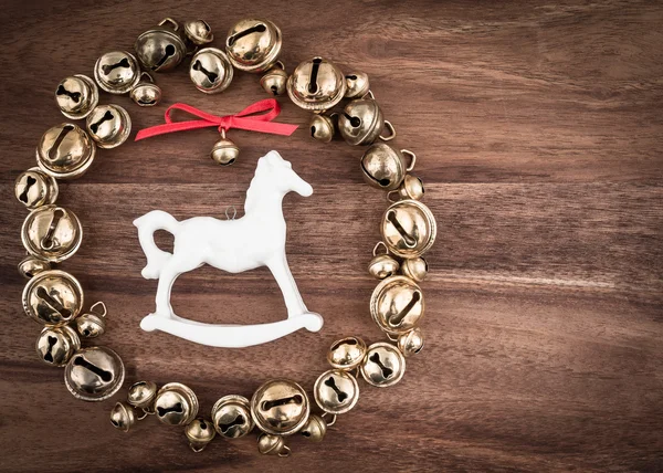 Bells in wreath and rocking horse
