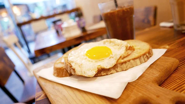 Breakfast sun egg bread with cold drink on the table