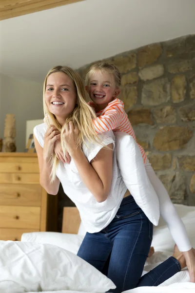 Mother and daughter playing together