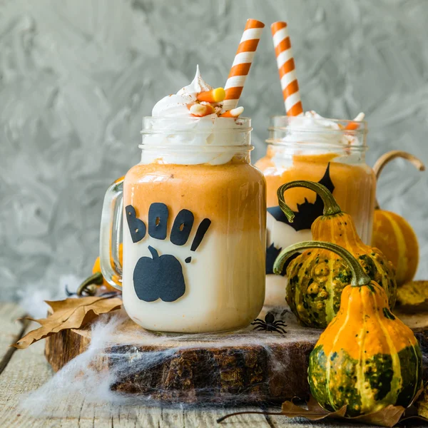 Halloween style pumpkin spice latte in glass jar