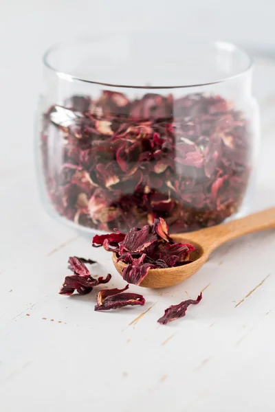 Dry hibiscus tea in glass jar