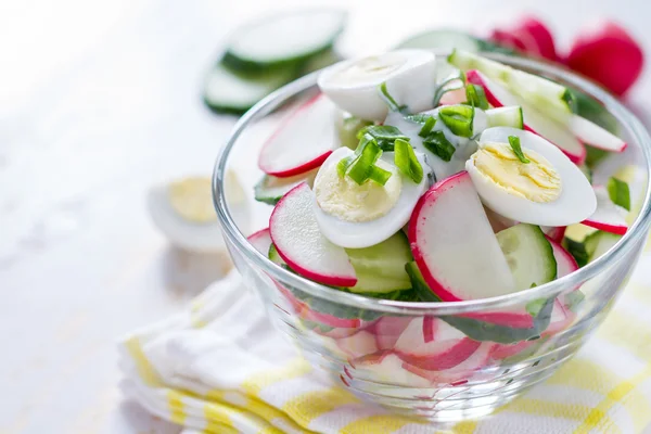 Yogurt salad in glass bowl with ingredients