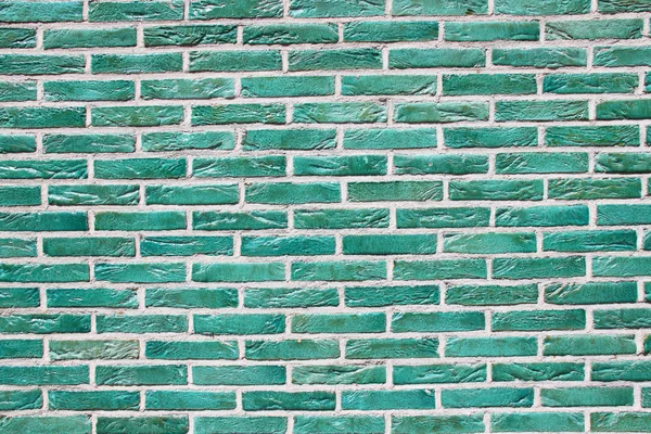 Green brick wall texture.