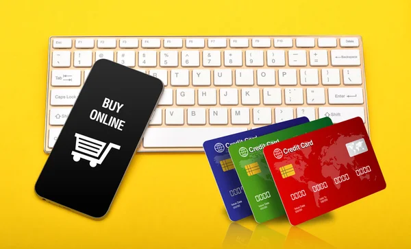 Buy online store icon with credit cards stack on keyboard