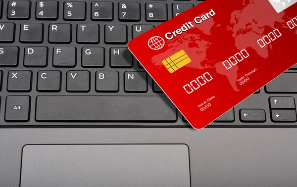 Credit Card on Keyboard Keys closeup view