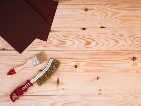 Tools for painting and repair on wood backdrop