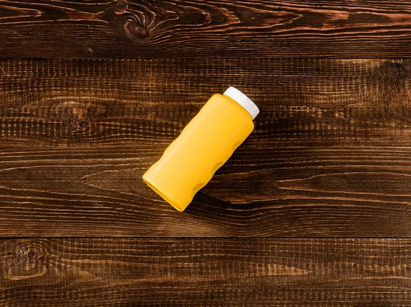 Baby talcum powder container on dark wooden background