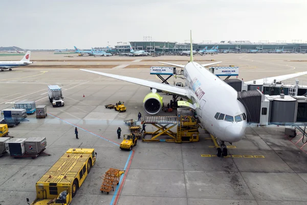 Airport officials are carrying the load.