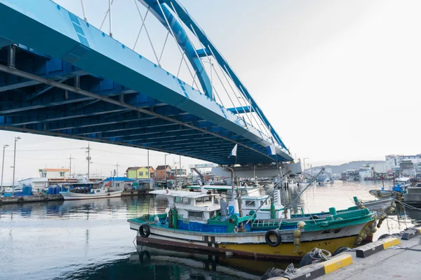 Bridge over river at fishing village in Korea.