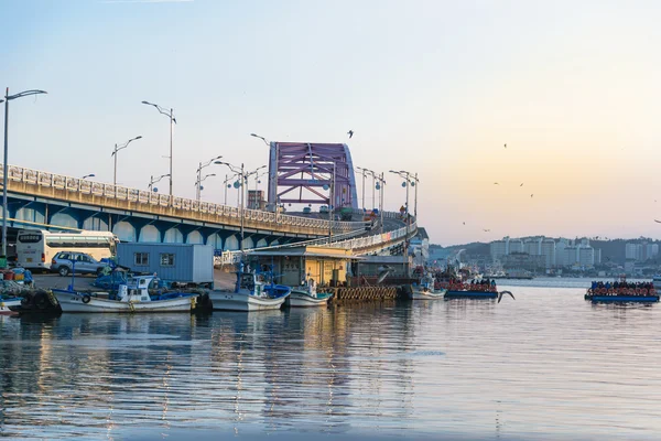 Bridge over river at fishing village in Korea.