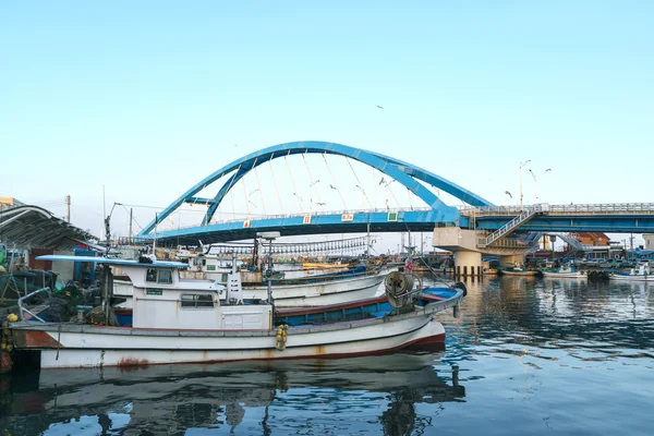 Bridge over river at fishing village in Korea.