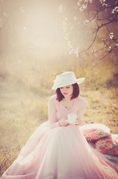 Girl spring, young girl, woman, brunette, Ukrainian, Russian, retro dress, photography, spring, blooming spring, cherry, apricot, blossomed apricot, flower, white flowers, grass, nature, trees, tea party, tea, delicious tea, drink tea, woman drinking