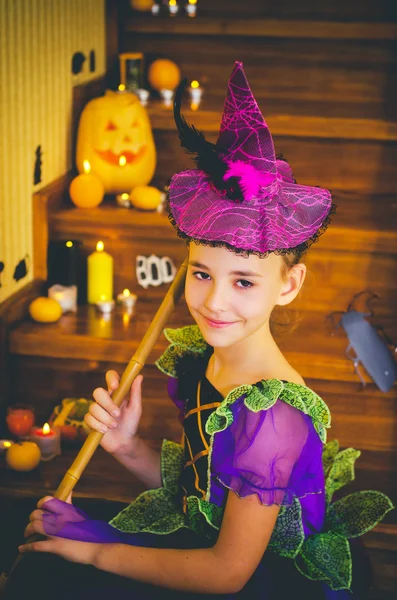 holiday, event, halloween, pumpkin, orange, candles, lit candles, rat, mouse, scary pumpkin, ladder, wooden ladder, girl, witch, little witch, witch costume, brew a potion, broom, broom for witches, smiling, witch hat , bell witch, Halloween, Hallow