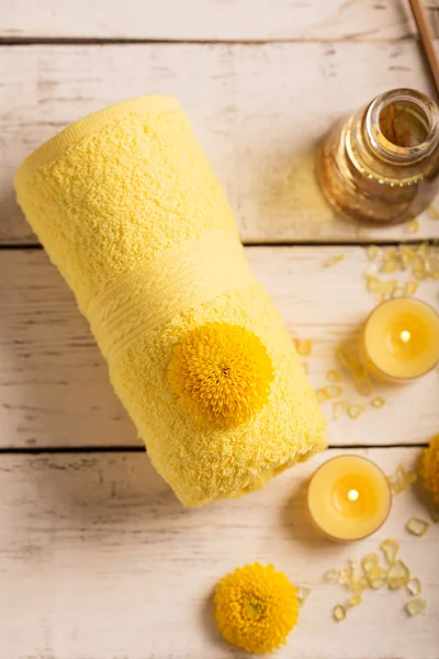 SPA still life with towel, candles and flowers