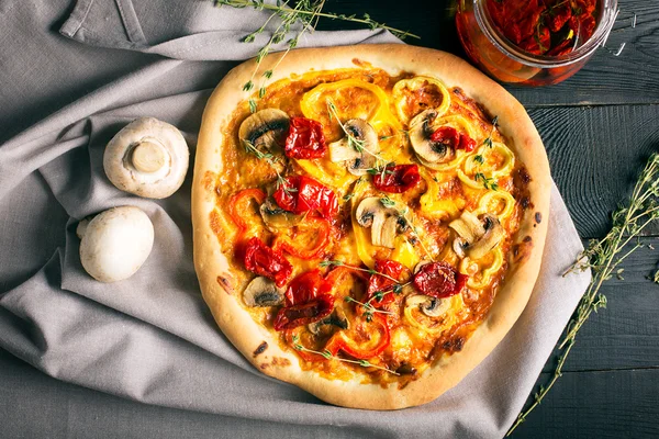 Vegan pizza with mushrooms and vegetables