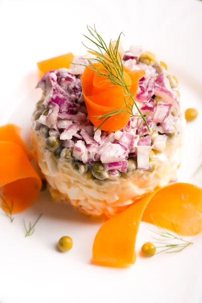 Traditional Russian salad olivie with boiled vegetables